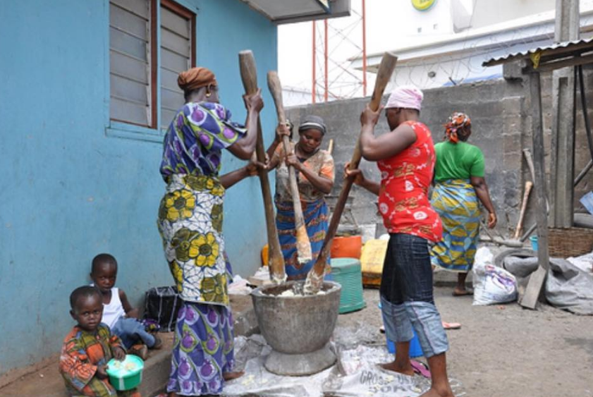 Ponding yam with motar and pestle